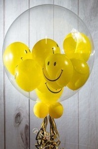 Emoji balloons inside clear bubble balloon
