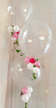 3 bubble balloons with trailing pink white red balloons