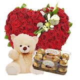50 red roses heart 1 foot teddy bear and 16 ferrero chocolates