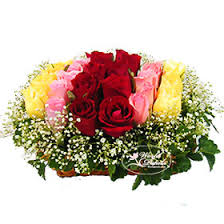 18 Mixed color flowers arrangement in a basket