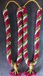 2 garlands with red and white flowers and beads