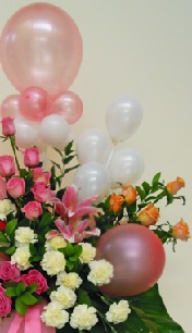6 Pink and 6 White small balloons arranged with 6 Pink roses 10 white carnations 6 Orange roses